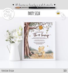 a winnie the pooh birthday party sign next to a vase with flowers on it