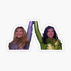 two women with their arms in the air and one is holding up her hand sticker