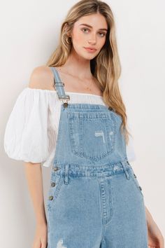 Choose comfort and style with the Women's Distressed Wide Leg Denim Overall. The adjustable straps, kangaroo chest pocket, and front and back pockets provide convenience, while the wide western legs, side buttons, and distressed accents add a trendy touch. Stay on trend in these comfortable, boho-inspired overalls. 34" INSEAM SLEEVELESSBUCKLE CLOSUREADJUSTABLE STRAPSKANGAROO CHEST POCKETFRONT/BACK POCKETSWIDE LEG Denim Wide Leg, Bib Overalls, Signature Look, Wide Leg Denim, Light Denim, Chest Pocket, Kangaroo, Heeled Boots, Overalls