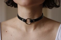 Genuine black leather choker. Made from firm 1.6 mm thick and 10mm width leather. Secured with snap buttons. If you want a different length just add it in comment section when placing your order. How to measure your neck: If you don't have a seamstress tape measure, take a piece of yarn or string and wrap that around your neck to a comfortable fit marking the point where the end touches itself. Lay the string straight next to a ruler and note the length. A choker should sit comfortably around yo Unique Choker, Leather Choker Collars, O Ring Choker, Black Leather Choker, Choker Handmade, Lingerie Vintage, Book Necklace, Heart Choker, Ring Der O