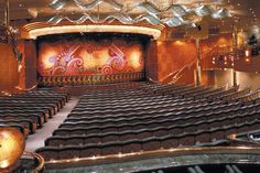 an empty auditorium with rows of seats