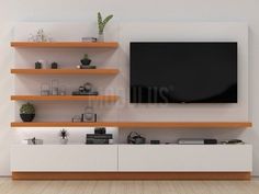 an entertainment center with shelves and a flat screen tv mounted on it's wall