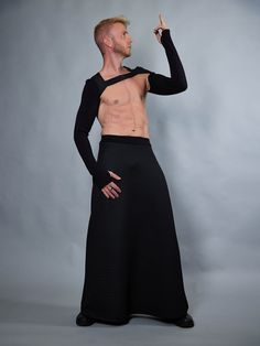 Black men's maxi skirt made of textured polyester jersey. The skirt is meant to be worn as a high waist.  The garment is sewn with Eloflex thread which minimizes the risk of seam breakdown on stretch fabrics. SIZE & MEASUREMENTS The size table is in the pictures. The waist is the place where the skirt's waistband should be. The waistband is made a bit smaller than the measurement so the skirt would sit nicely in place. The skirt comes in 6 sizes. Standard length  105 cm / 41 inches. You can also Men Skirt, Men In Skirts, Cyberpunk Clothes, Kilt Skirt, Goth Dress, Androgynous Fashion, Futuristic Fashion, Kilt, Skirt