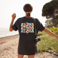 "Aloha Hibiscus Flowers Shirt, Hibiscus Flower Tee, Aloha T-Shirt, Hawaiian Shirt, Hawaii Beach Tee, Funny Aloha Shirts, Cute Summer T-Shirt ☀️☀️☀️☀️☀️ Everything in our shop is hand crafted and made to order. If you want different color or size contact me! If you would like something custom made to fit your personal style please message me and I will do everything to get you that something special. ---How To Order--- ⭐️Please, check and review all photos ⭐️Choose your t-shirt size and color ⭐️Enter your Design Color Example: \"White\" ⭐️Click add to cart. You can go back to add more product ⭐️Click \"Proceed to check out\" ⭐️When you check out, you can add a note to seller for any request *High quality and super soft, comfortable shirt. Made with top of the line vinyl and pressed with a p Tropical Multicolor T-shirt For Vacation, Multicolor Hawaiian T-shirt For Beach Season, Multicolor Short Sleeve Tops With Hibiscus Print, Multicolor Hibiscus Print Short Sleeve Tops, Multicolor Hawaiian T-shirt Relaxed Fit, Multicolor Hawaiian T-shirt With Relaxed Fit, Multicolor Hawaiian Printed T-shirt, Multicolor Hawaiian Relaxed Fit T-shirt, Hawaiian Style Multicolor Relaxed Fit T-shirt