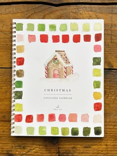 a christmas card with a gingerbread house and candy canes on the front cover