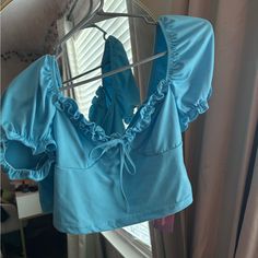 Blue Crop Top With Short Sleeves. Never Worn Trendy Blue Tops For Day Out, Fitted Light Blue Summer Top, Blue Stretch Summer Tops, Blue Stretch Tops For Vacation, Trendy Blue Vacation Tops, Blue Fitted Tops For Day Out, Blue Stretch Tops For Day Out, Button Crop Top, Bandana Top