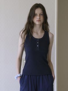 This is a minimal and feminine top by Tillber that is made out of high quality and sturdy material. With distinctive mood of the design and comfortable wear, you can style it for your casual daily outfit.- Deep U neckline- Bamboo fabric ribbing detail- Real sea shell button- Minimal and feminine mood Navy Tops For Everyday Spring Wear, Navy Top For Everyday Spring Wear, Casual Navy Tops For Everyday, Navy Casual Tops For Work, Casual Navy Tops For Work, Versatile Cotton Tops With Buttons, Casual Navy Tops For Loungewear, Navy Top For Spring Loungewear, Navy Stretch Tops For Work