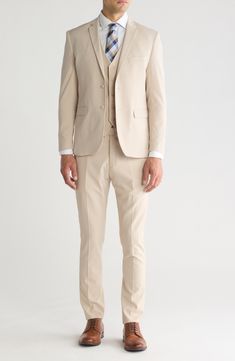 Stretch construction and a skinny cut mean modern appeal from a head-turning three-piece suit. Jacket has notched lapels; chest welt pocket; front welt pockets Vest has front button closure; V-neck Pants have zip fly with button closure; front slant pockets; back button-welt pockets Jacket and vest are lined; trousers are lined to the knee 62% polyester, 35% viscose, 3% spandex Dry clean Imported Each suit has a 6” drop, meaning that a size 38R jacket is paired with size 32 pants Fitted Single Breasted Three-piece Suit With Notch Lapel, Fitted Single Breasted Pantsuit With Suit Collar, Fitted Pantsuit With Pockets And Suit Collar, Fitted Single-breasted Pantsuit With Suit Collar, Classic Beige Pantsuit, Fitted Pantsuit With Hidden Button Closure, Fitted Pantsuit With Pockets And Lapel Collar, Slim Fit Notch Lapel Suit With Welt Pockets, Slim Fit Single Button Suit With Notch Lapel