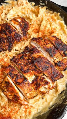 chicken and rice in a skillet on a table