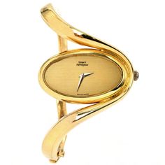 "This Vintage 1980s Girard Pearragaux solid gold bangle watch. This collectible Vintage piece is crafted in highly polished 18K Yellow Gold, weighing 77.0 grams and measuring 6\" around the wrist. An inversed oval, wave bangle watch, with a unique and elegant look. The inner movement is the Chopard brand. Secured with a hinged insert clasp. Hallmarked & Numbered: 51383 and 5047-1 In excellent condition This purchase is accompanied by a professional appraisal document." Luxury Vintage Hallmarked Jewelry And Watches, Gold Bangle Watch, Solid Gold Bangle, Chanel Perfume, Bangle Watches, Gold Armband, Jewelry Appraisal, Luxury Timepieces, Jewelry Lookbook