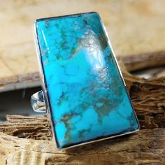 "Natural Best Grade Kingman Arizona Turquoise .925 Sterling Silver Ring Size 6 1/2 Weighs 9 Grams, Face Measures 5/8\" x 1\" GH18. Vibrant bluish green color and beautiful patterns! This is a handpicked natural stone, the exact one shown in picture. The sterling silver is .925 and stamped. Each piece is hand made by artisans in my shop. The quality of the stones and the silver workmanship is impressive. Please look at other items in my store. I sell ready-made jewelry with hand crafted silver work, pendants with a sterling silver bails and beautiful unique cabochons for jewelry wire wrapping and weaving. You will pay exact amount on shipping plus $1 for supplies and labor. All items are shipped within a couple of days after payment and are shipped USPS first class or international first cl Rectangular Turquoise Gemstone Ring, Handmade Turquoise Rectangular Rings, Unique Rectangular Turquoise Ring, Rectangular Blue Turquoise Gemstone Ring, Rectangular Turquoise Rings For Anniversary, Rectangular Turquoise Ring For Anniversary, Anniversary Turquoise Rectangular Ring, Anniversary Rectangular Turquoise Ring, Kingman Arizona