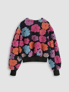 Be bold in this plus-sized sweater! A multi-color pattern of puffy flowers adds a vibrant touch to this long-sleeve pullover. The oversized fit and comfy 100% acrylic fabric make this round-neck sweater as cozy as it is unique. Enjoy a multi-color moment with this unique sherpa flower-embroidered jacquard-knit color-blocked top. Oversized Long Sleeve Floral Print Sweater, Oversized Long Sleeve Sweater With Floral Print, Trendy Multicolor Floral Print Sweater, Flower Sweater, Acrylic Fabric, Round Neck Sweaters, Jacquard Knit, Embroidered Flowers, Long Sleeve Pullover