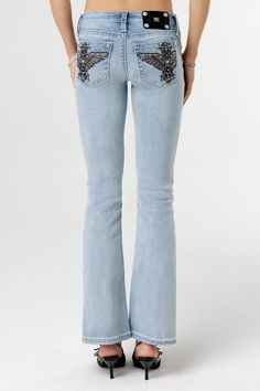 Low-rise, light-wash bootcut jeans- Embroidered winged cross with black leather- Mini rhinestone and pearl details- Rhinestone rivets- Heavy fading Model is wearing size: 26Model Measurements:Height: 5'8"Bust: 35"Waist: 26"Hips: 39" Fabric Content: 52% Cotton, 27% Lyocell, 20% Polyester, 1% ElastaneCare: Gentle machine wash inside-out with like colors in cold water, Tumble dry low Style No. L9339B-L291, L9339BS-L291 Straight Clothes, Pearl Details, Low Rise Jeans, Black Friday Shopping, Denim Outfit, Leather Mini, Miss Me, Jean Outfits, Ever After