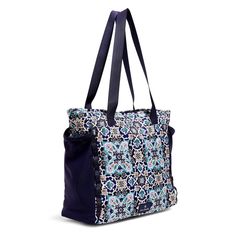 Vera Bradley Large Sport Tote Bag in Lisbon Medallion Cool Vera Tote Bag in ReactiveThis bag makes your workout easier.   This tote will keep you organized and ready to go.  Don't forget to pack your motivation! Exterior has two side pockets and a slip pocket Interior features three slip pockets Zip closure. Dimensions: 15.0" w x 14.0" h x 6.0" d with 12.0" strap drop Item: Sport Tote Bag SKU# 2965915566 UPC# 886003935194 Fabric details ReActive- Vera Bradley has designed ReActive to move through the world with ease.  Lightweight, water-repellent fabric is easy to clean, making it ideal for travel and the waterside.  This collection’s exterior is made with 50% recycled plastic exterior fabric. Top Features: Durable, Lightweight, Water-Repellent Fabric Vera Bradley's dimensions are industry Blue Multifunctional Sports Bag, Multifunctional Blue Sports Bag, Sporty Blue Bag With Water Bottle Pocket, Nylon Bags With Water Bottle Pocket For Daily Use, Sporty Shoulder Bag With Water Bottle Pocket For Travel, Sporty Travel Shoulder Bag With Water Bottle Pocket, Practical Bags With Water Bottle Pocket For Daily Use, Rectangular Nylon Shoulder Bag For Gym, Rectangular Nylon Gym Bag For Daily Use