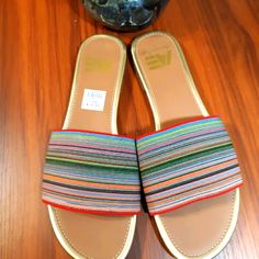 Never Worn Flat Open Toe Multicolored Women Sandals. Multicolor Closed Toe Sandals With Cushioned Footbed, Multicolor Slide Sandals For Beach, Multicolor Flat Sandals With Cushioned Footbed, Multicolor Flat Heel Sandals With Cushioned Footbed, Casual Multicolor Slide Sandals, Multicolor Flat Sandals For Summer, Multicolor Flat Slides For Spring, Multicolor Synthetic Slip-on Flip Flops, Casual Multicolor Adjustable Slides