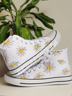 "-🌼DAISY DESIGN🌼- 🌈DESCRIPTION: You will receive a unique pair of shoes which I will personally paint by hand just for you.  I create your shoes from scratch by hand in my little studio. The main design is painted on the outside of the shoes only, while on the inside the shoes are painted with the same minimalist decorations to match with the outside. 🔥UNIQUE: As the shoes are PAINTED BY HAND, the design may slightly vary from the picture. Each design is unique in its own way. 🎨CUSTOMISE THEM: As the shoes are made to order, feel free to make them even more unique. In fact it is possible to customise them, adding a text, a date or a name on the inside of the shoes or even in the corner, on the outside next to the characters. Simply leave me a note at the checkout with the details you Artsy White High-top Sneakers, Hand Painted Canvas Shoes With Round Toe, Hand Painted Round Toe Canvas Shoes, Hand-painted Canvas Shoes With Round Toe, Hand Painted White Low-top Canvas Shoes, Casual Hand Painted White Custom Sneakers, Casual Hand Painted White Sneakers, Artsy Hand Painted White Custom Sneakers, White Hand Painted Low-top Canvas Shoes