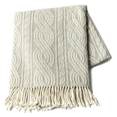 a white blanket with fringes on the bottom and an image of a cable knit pattern