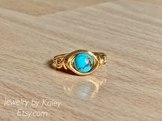 Turquoise ring. Unique and simple gold filled wire wrapped ring. Handmade ring. #wirewrappedjewelry #turquoisejewelry #goldrings #handmadejewellery Adjustable Gold Turquoise Ring, Gold Adjustable Turquoise Ring, Adjustable Gold Turquoise Ring In Spiritual Style, Adjustable Gold Spiritual Turquoise Ring, Handmade Dainty Adjustable Turquoise Ring, Handmade Gold Bohemian Turquoise Ring, Handmade Bohemian Gold Turquoise Ring, Bohemian Turquoise Wire Wrapped Rings, Handmade Adjustable Turquoise Crystal Ring