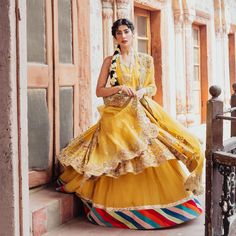 Yellow Chanderi Lehenga With Dabka Detailing, Traditional Sharara With Tilla For Designer Wear, Yellow Traditional Drape Gown, Yellow Floor-length Dabka Sharara, Designer Yellow Lehenga With Dabka Detail, Designer Yellow Lehenga With Dabka Embroidery, Yellow Raw Silk Dress With Intricate Embroidery, Yellow Cutdana Dress For Transitional Season, Traditional Yellow Gown With Intricate Embroidery