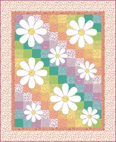 a colorful quilt with white flowers on it