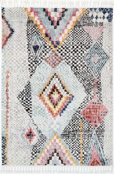 a multicolored area rug with fringes and diamonds on the edges, in various colors