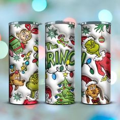 three christmas themed tumblers with the grin on them