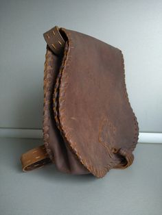 Vintage genuine leather bag - Retro leather bag - Old leather bag from 70' - brown leather bag - Old Genuine Leather Bag - Shoulder bag Beautiful shoulder bag made of genuine leather . For people who love items with history . Dimensions : 28 cm x 29 cm x 10 cm For other GENUINE LEATHER BAG please check here : https://www.etsy.com/shop/TheVINTAGEShopBG?ref=l2-shopheader-name&section_id=22456024 All pictures are real . You buy exactly what you see in the photos . Thank you for visiting my stor Brown Saddle Bag With Leather Backing For Daily Use, Leather Saddle Bag With Leather Backing Rectangular, Rectangular Leather Saddle Bag With Leather Backing, Rectangular Leather Saddle Bag, Brown Satchel Saddle Bag With Leather Lining, Leather Pouch Satchel With Leather Lining, Leather Saddle Shoulder Bag For Daily Use, Brown Leather Lined Backpack, Cognac Leather Saddle Bag Satchel