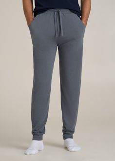 Sleep Tight in Right-Sized Tall Men's Jogger Pants For Tall Guys Who Dream Big Say goodnight to high-water pajamas and hello to our Sleep Joggers for Tall Men, where comfort meets length to fit like a dream. Designed specifically for taller guys, these extra-long men's joggers offer full-length coverage, an elastic waist with an internal drawstring, and a relaxed fit that’s just right for winding down. The soft fabric ensures you stay comfortable all night long, while the practical pockets mean 4-way Stretch Full-length Sweatpants For Loungewear, Cheap Men's Joggers For Loungewear, 4-way Stretch Sports Joggers With Tapered Leg, 4-way Stretch Sweatpants With Pockets For Loungewear, Say Goodnight, 4-way Stretch Joggers With Pockets For Loungewear, Cozy Sleepwear, Smoky Blue, Mens Jogger Pants