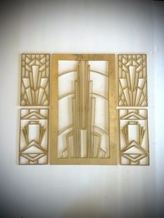 an art deco wall hanging made out of plywood and wood with glass panels on each panel