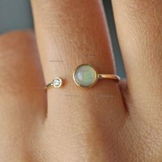 This Ring is made in solid 14k Yellow Gold Opal Gemstone and Diamond Cuff Ring. Best Gift For Anniversary, Birthday and Other Occasion.  Also available in Rose Gold, White Gold and Yellow Gold Product info: 14k solid gold ★Details ★ SKU Code : 2390 ★Purity : Solid 14k Gold ( Also available in 9k & 18k Solid Gold) ★Metal : Yellow Gold ( Also available in Rose Gold & White Gold) ★Gemstone : 100 % Genuine Opal ( Also available in Other Gemstone) ★Stone Shape : Round ( Also available in Other Shape) Gemstone Bypass Promise Ring, Yellow Gold Opal Open Ring For Anniversary, Adjustable 14k Gold Opal Birthstone Ring, Adjustable Fine Jewelry Opal Ring For Anniversary, Adjustable Yellow Gold Opal Ring For Anniversary, Anniversary Opal Open Ring With Gemstone, Anniversary Stackable Opal Open Ring, Adjustable Open Opal Ring For Anniversary, 14k Gold Open Opal Ring For Anniversary