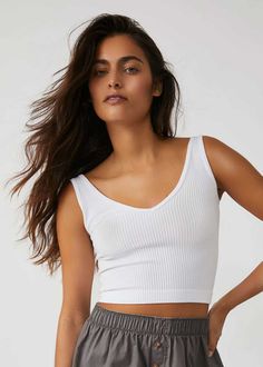 One part bra, one part cami, this Free People brami is featured in a super soft ribbed fabric. V-neckline. Stretchy fit. 50% Rayon 45% Nylon 5% Spandex. Model is wearing a size S.