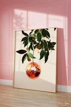 a plant in a vase is hanging on the wall next to a pink painted room