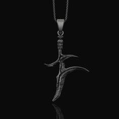 Black Knife Charm Necklace, Elden Ring Inspired, Gift for boyfriend, Geek Gift, Videogame Lover, Elden Ring Pendant Step into the realm of dark fantasy with our Elden Ring Necklace. An emblem of mysticism and power, this piece showcases a beautifully crafted Fantasy Dagger reminiscent of the intricate weapons found in beloved RPG adventures. The Black Knife, set against the backdrop of the Elden Ring, evokes memories of epic quests and powerful symbols from the game. For the adventurers at heart Gothic Jewelry For Halloween, Gothic Streetwear Jewelry For Halloween, Black Warrior Style Jewelry As Gift, Black Warrior Style Jewelry For Gift, Black Ankh Jewelry For Gifts, Black Jewelry For Halloween Fantasy Events, Gothic Streetwear Jewelry, Black Metal Fantasy Jewelry, Black Ankh Metal Jewelry