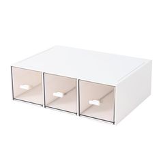 a white box with three drawers on top