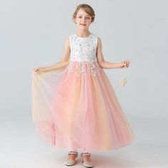 Elegant and timeless, this Lace Up Pearl and Sequin Accentuated Elegant Girls Ball Gown is perfect for her big day. Crafted in soft, silky fabric with an ornate pattern and stylish appliques, this party dress is sure to make her feel like a princess. This dress is the perfect way to make any day special! Features: Appliques decoration. Floral pattern. Lantern sleeves. Elegant and fashionable. Comfortable to wear. Mid-calf length. Fabric & Care: Made of high-quality polyester and cotton fabric. H White Princess Gown For Prom Season, White Princess Dress For Wedding And Prom Season, White Princess Dress For Wedding And Prom, White Princess Ball Gown Floor-length, Spring Gown With Lace Bodice In Tulle, Princess Style White Floor-length Ball Gown, White Princess Floor-length Ball Gown, Princess Style Floor-length Lace Dress, White Princess Dress For Prom Season