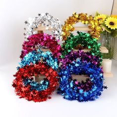 three different colored wreaths sitting next to each other