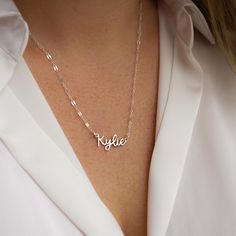 Escape to the Amalfi coast with our beautiful Amalfi Name Necklace! Its delicate design will turn heads and inspire confidence - making you feel like you can conquer anything! NECKLACE FEATURES Choice of 18k gold plating over sterling silver or Sterling Silver handcrafted custom name pendant (approx.* 1", up to 10 characters) Choice of Metal: Gold Fill or Sterling Silver Choice of Chain Style: Cable Chain or Upgraded Specialty Link Chain All necklace findings are gold filled/sterling silver. Eac Silver Name Chain, Name Chain Gold Design, Silver Name Necklace, Name Pendant, The Amalfi Coast, Freshwater Pearls Earrings, Delicate Design, Chain Extenders, Yellow Gold Chain