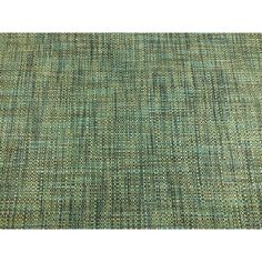 a green rug with small squares on it