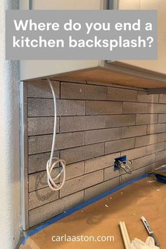 a kitchen backsplash with the words where do you end a kitchen backsplash?