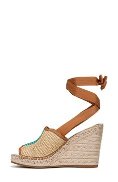 A double layer of braided jute adds tropical lift to a boho leather sandal detailed with tiny gleaming studs on the heel straps. 2" heel; 1 1/4" platform (size 8.5) Adjustable strap with hook-and-loop closure Leather upper/synthetic lining and sole Imported Women's Shoes Straw Platform Wedge Sandals, Straw Wedge Sandals With Flat Heel And Platform, Straw Wedge Sandals With Flat Heel, Adjustable Woven Leather Sandals For Summer, Natural Straw Closed Toe Wedge Sandals, Ankle Strap Heels With Removable Insole For Beach, Bohemian Platform Wedge Sandals For Summer, Beach Heels With Removable Insole And Ankle Strap, Summer Espadrille Sandals With Wrapped Heel