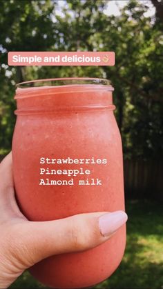 someone holding up a pink smoothie in their left hand with the words, simple and delicious