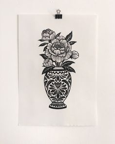 a black and white drawing of flowers in a vase