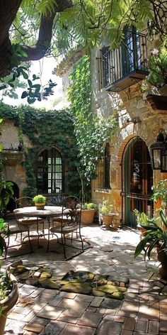 an outdoor patio area with tables and chairs