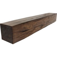 a wooden shelf sitting on top of a white wall