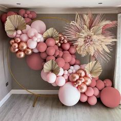 a room with pink and gold decorations on the wall