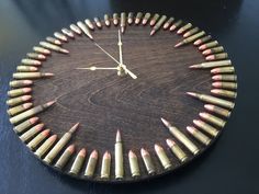 a clock made out of pencils on a table