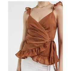 Express Satin Ruffle Wrap Cami Brown, Size Xs. Features & Fabric V-Neck Sleeveless; Ruffle Straps Wrap Front With Side Tie Closure Ruffle Trim On Hem Nylon/Lyocell Cheap V-neck Top With Ruffle Hem, Fitted V-neck Camisole With Ruffles, Fitted V-neck Camisole For Brunch, Chic V-neck Ruffled Camisole, V-neck Ruffled Camisole For Day Out, Chic Sleeveless Top For Brunch, Chic Fitted Camisole For Brunch, Summer V-neck Ruffled Camisole, Flirty V-neck Top For Brunch