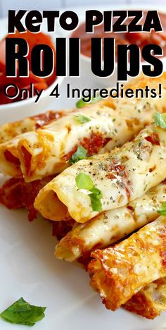 the keto pizza roll ups are on a plate with sauce and basil garnish