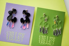 Earrings are 3.5 inches in length. The black earrings have iridescent drops that change color depending on the lighting. The clear pair has mirror drops. Small imperfections are normal. Store in a cool dry place, avoid storing earrings where the acrylic can get scratched. These earrings are very lightweight. Clean with a microfiber cloth. Storing Earrings, Earring Packaging, Laser Cut Jewelry Acrylic, Etsy Shop Branding, Contemporary Handmade Jewelry, Shop Branding, Quirky Jewelry, Acrylic Earring, Electroformed Jewelry