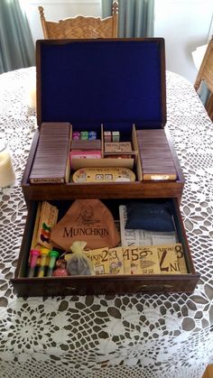 an open wooden box sitting on top of a table